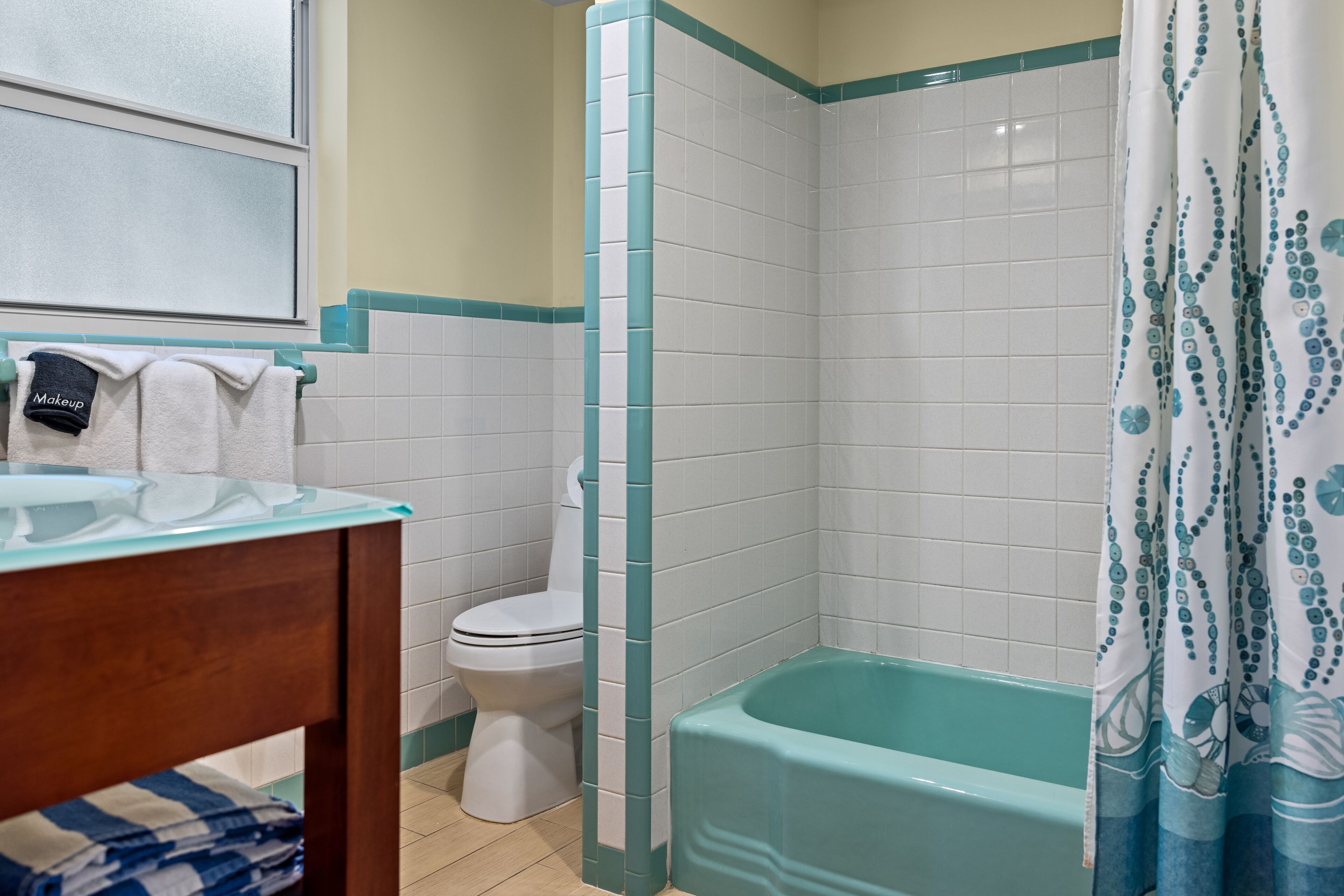 deluxe 1 bedroom  | bathroom | shower, hair dryer, towels