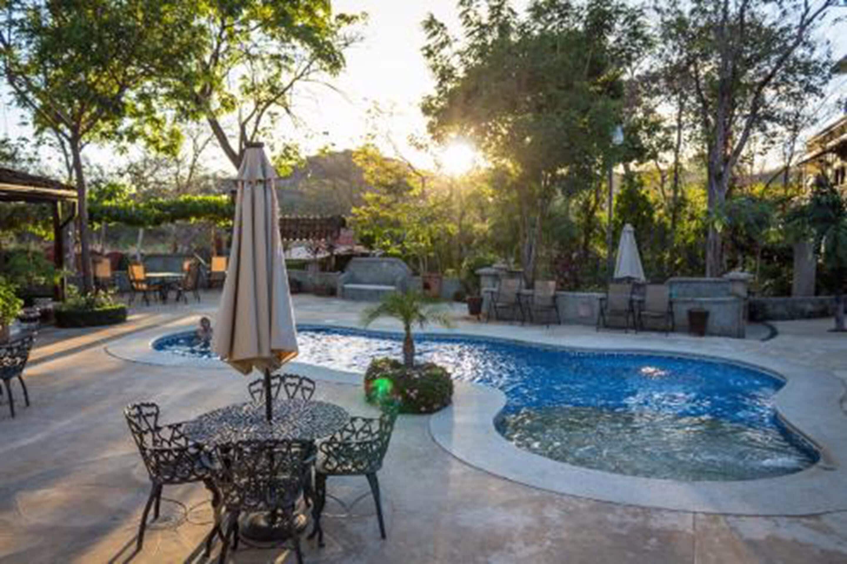 outdoor pool, pool umbrellas, pool loungers