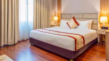 Deluxe Two Bedroom Family Suite | Minibar, in-room safe, desk, laptop workspace