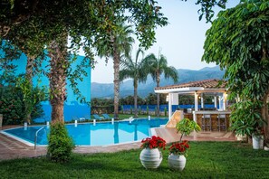 Outdoor pool, pool umbrellas, pool loungers
