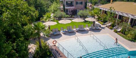 Outdoor pool, open 11 AM to 4:00 PM, pool umbrellas, sun loungers