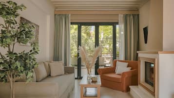 Family Suite, 1 Bedroom, Fireplace | Living area | 32-inch LED TV with cable channels, TV