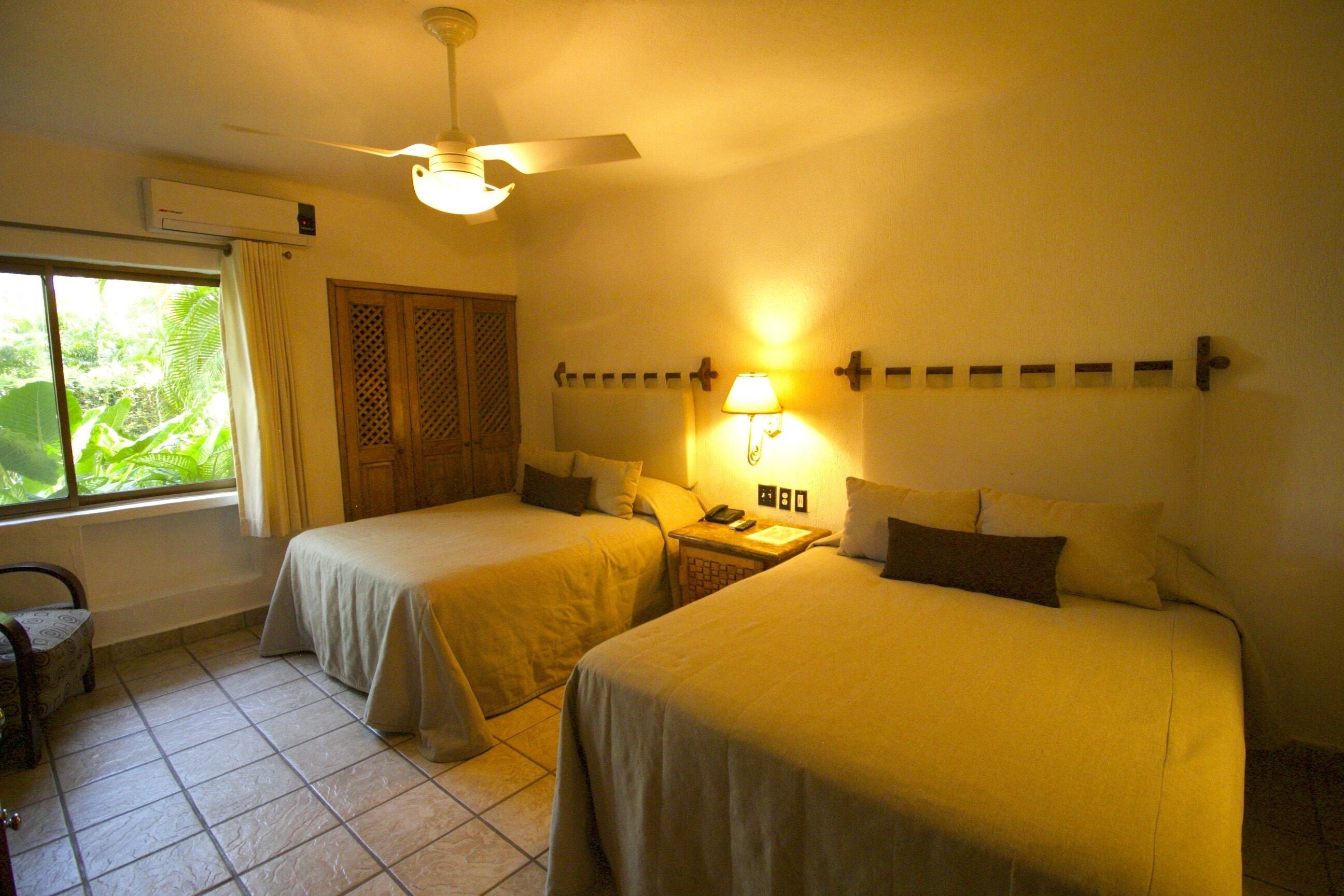 Quarto standard | Frigobar, cofres nos quartos, Wi-Fi de cortesia, roupa de cama