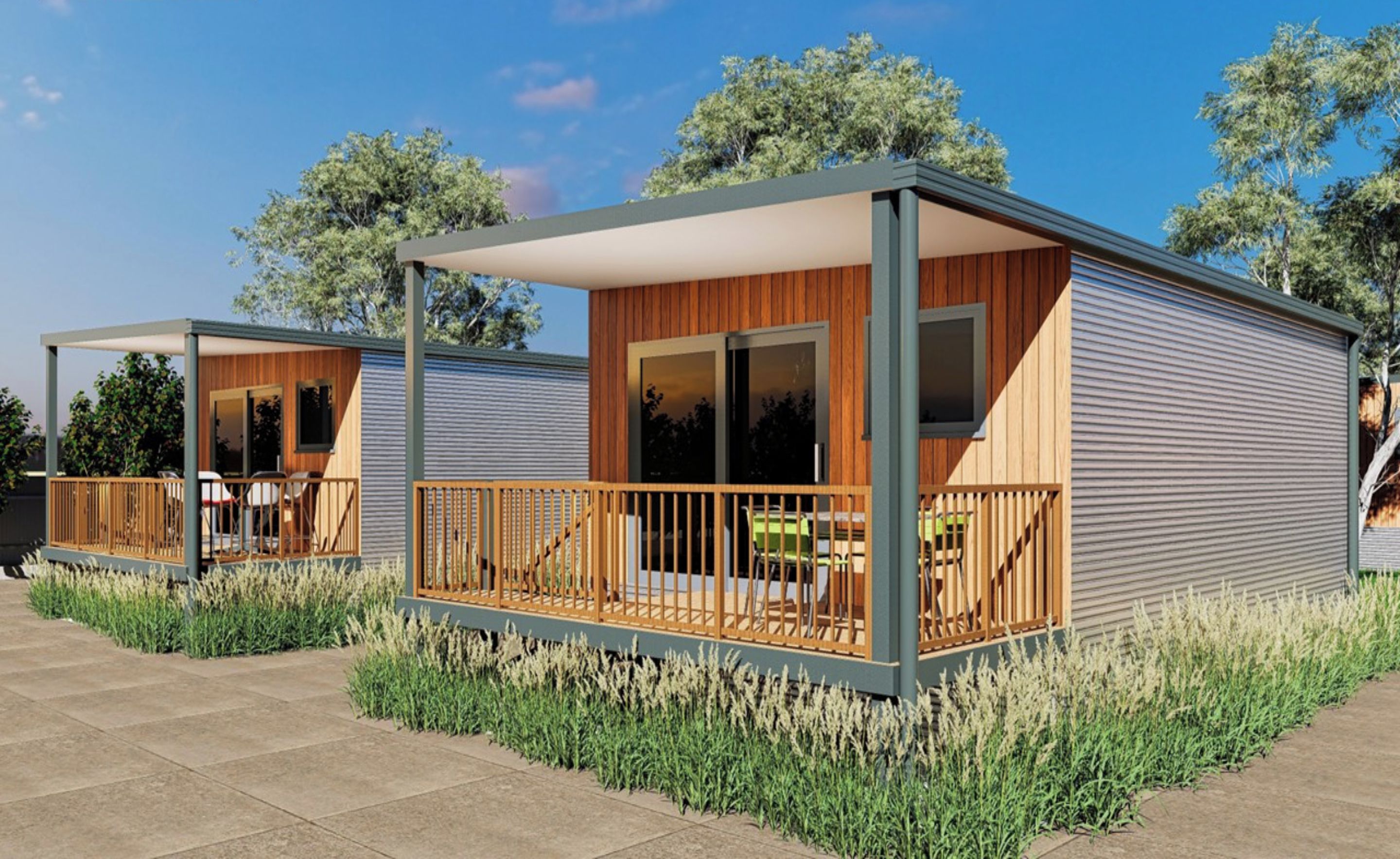 A modern, two-story building with a covered patio area, large windows, and a wooden deck.