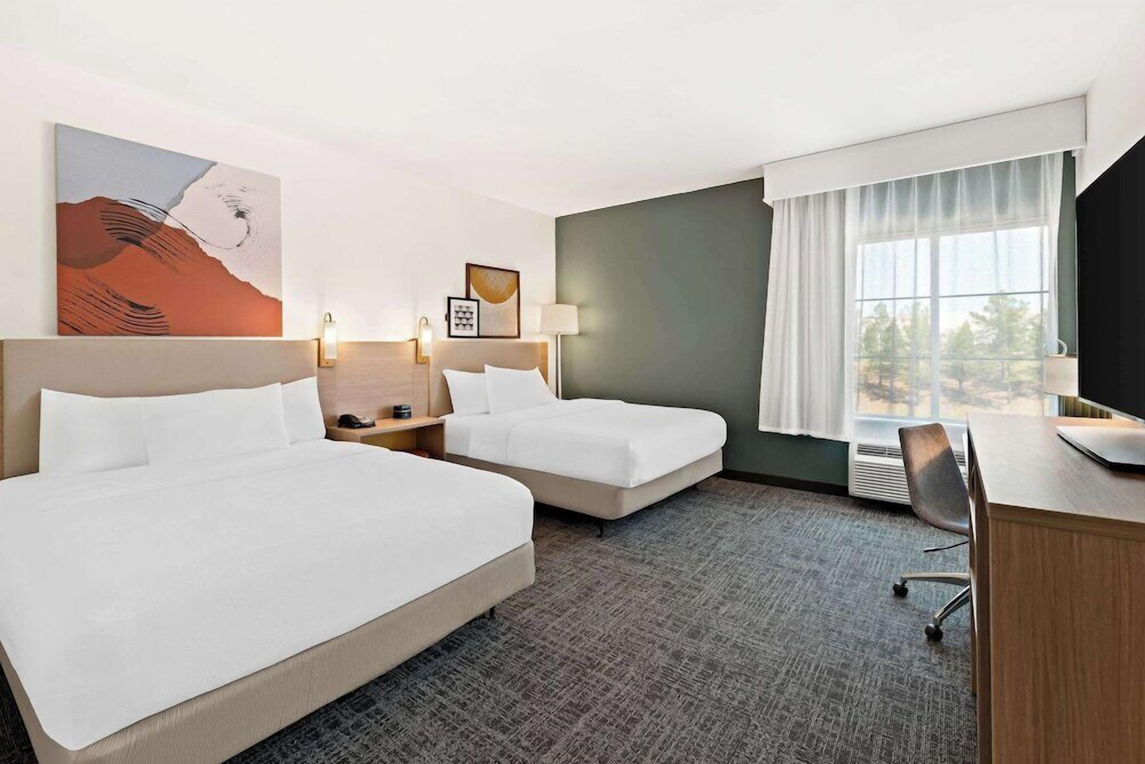 Premium bedding, pillowtop beds, desk, laptop workspace