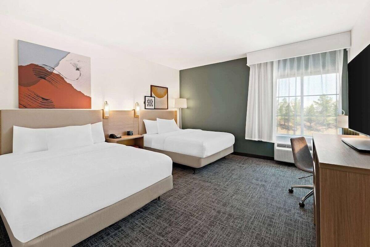 Premium bedding, pillowtop beds, desk, laptop workspace