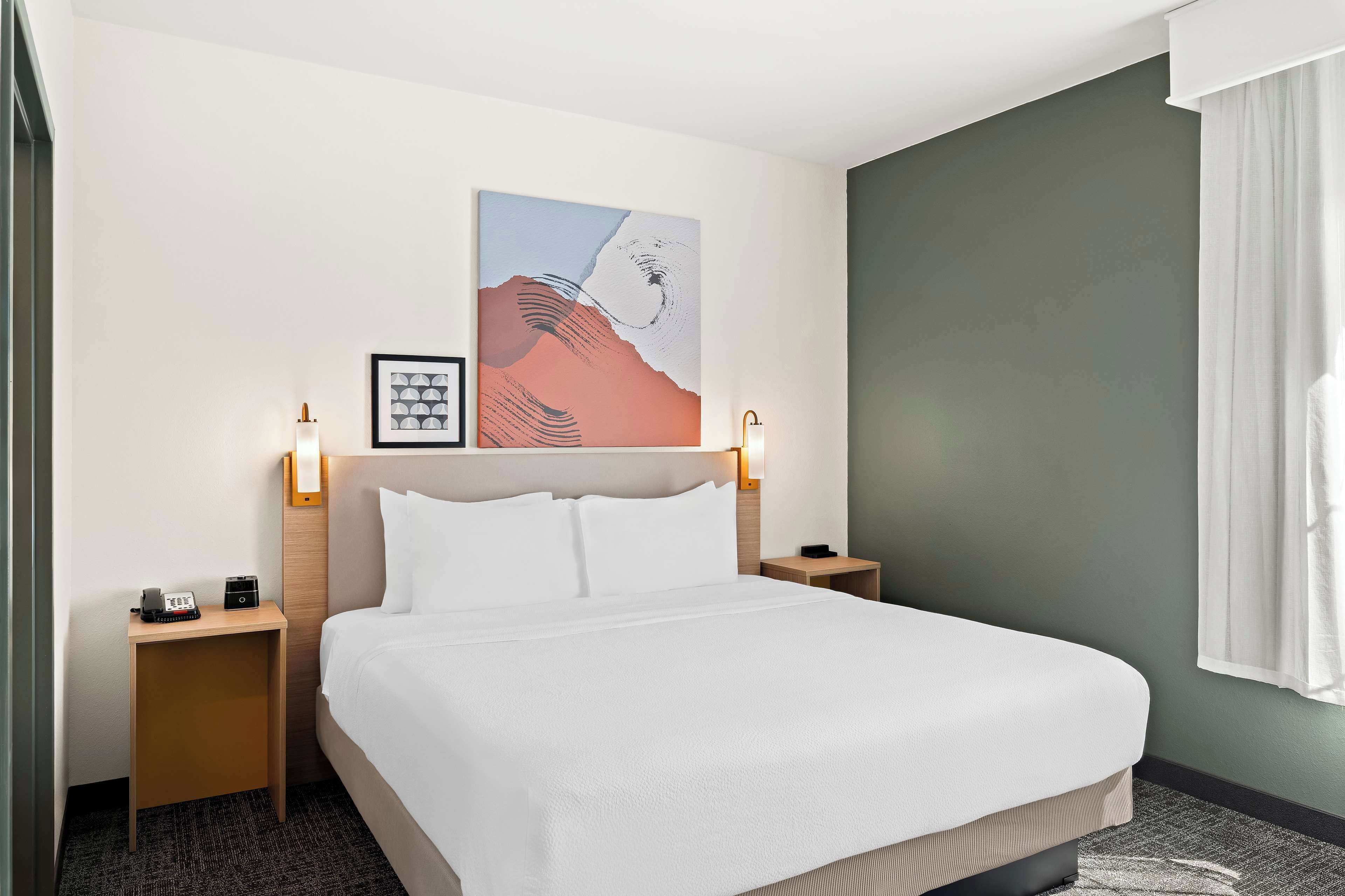 premium bedding, pillow-top beds, desk, laptop workspace