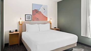Premium bedding, pillowtop beds, desk, laptop workspace