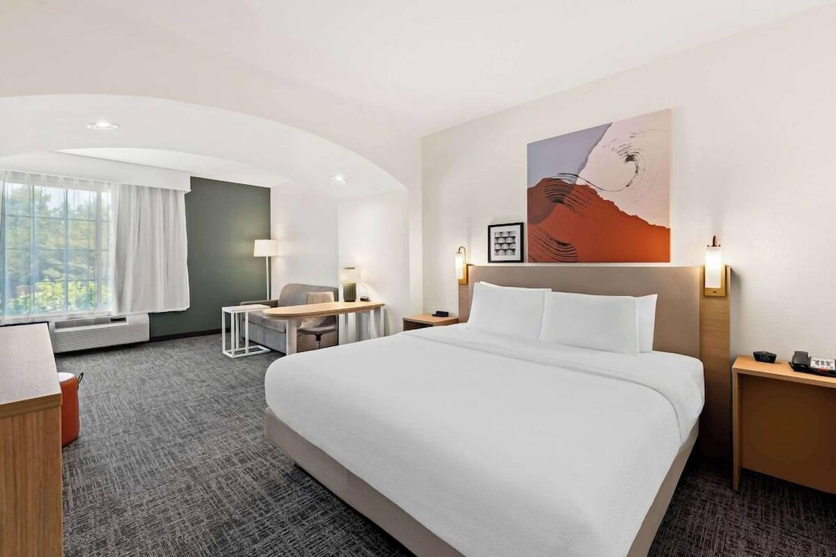Premium bedding, pillowtop beds, desk, laptop workspace