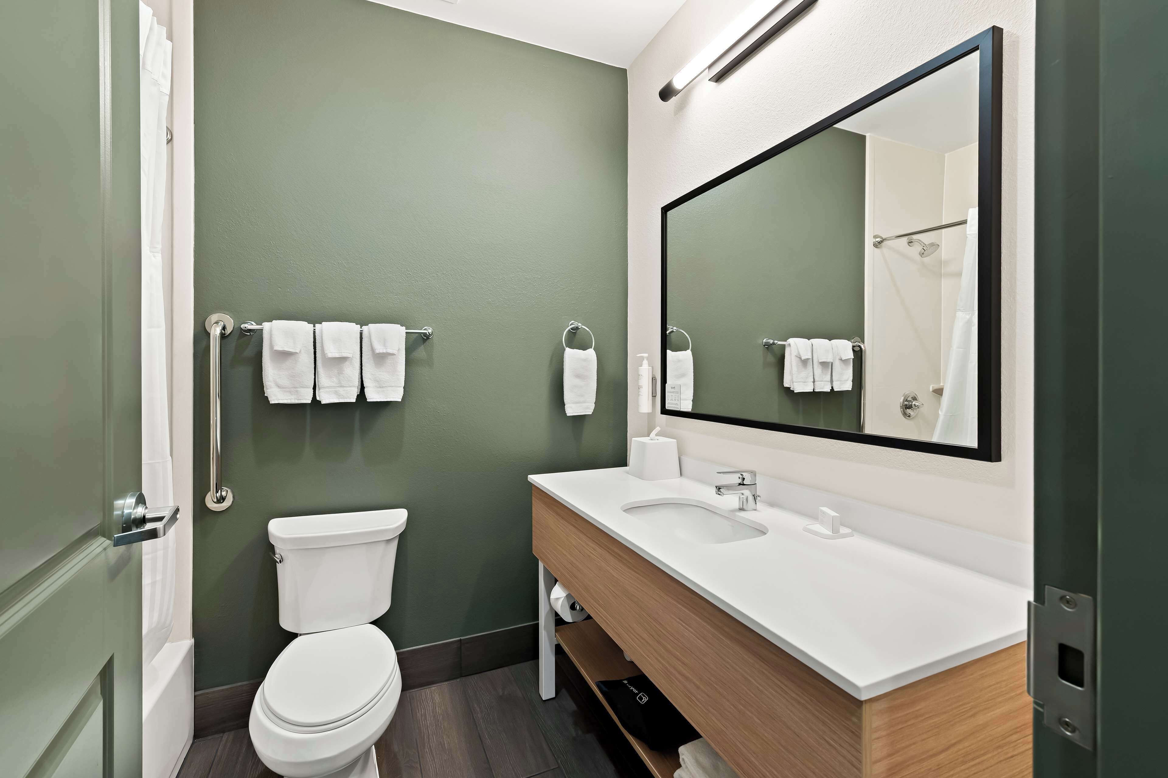 room, 2 queen beds | bathroom | free toiletries, hair dryer, towels