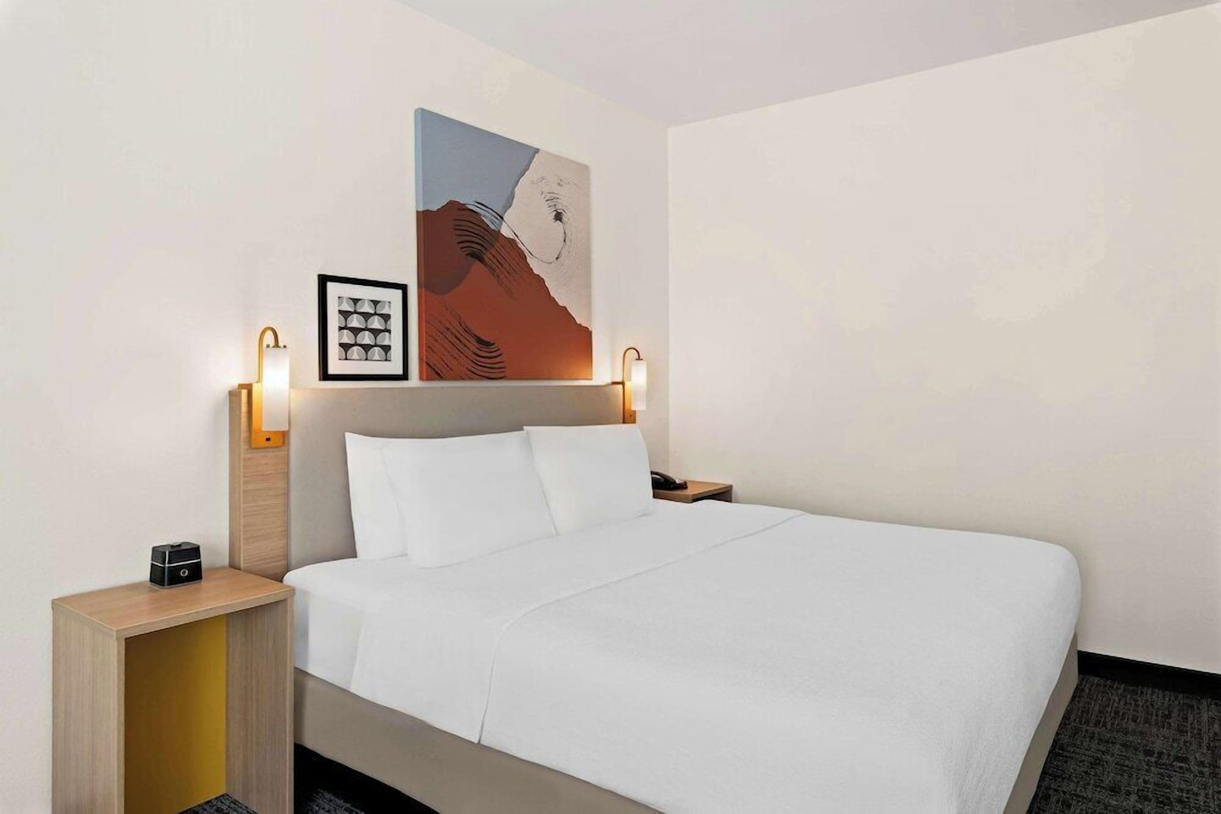 Premium bedding, pillowtop beds, desk, laptop workspace