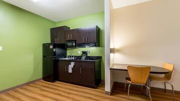 Full-sized fridge, microwave, stovetop, coffee/tea maker