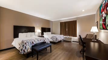 Desk, blackout drapes, iron/ironing board, free cribs/infant beds