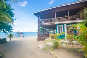 On the beach, sun-loungers, beach towels - Modern Beachfront Casita with Dock and pool ON THE BEACH (Sandy Bay)