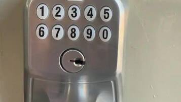 A modern numeric keypad door lock.