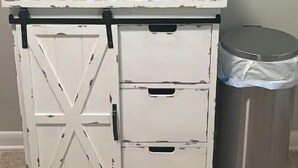 A white cabinet with a microwave on top, a trash can, and a bowl with snacks. - Five Points neighbor. Located 1.4 from UGA stadium. (Athens)