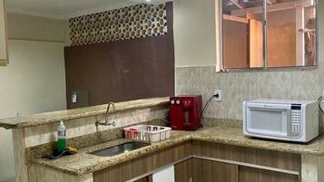 Villa | Private kitchen | Fridge, microwave, oven, blender