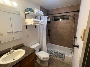 Shower, hair dryer, towels, soap