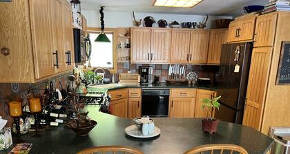 Waterfront retreat on 7 private wooded acres with beautiful sunset views.