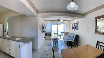 Comfort Condo | Living area | 30-inch TV with cable channels