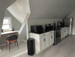 Fridge, microwave, oven, stovetop - Modern Large Studio Apartment in Heart of Tremont. (Cleveland)