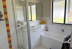 Bathtub, hair dryer, towels, soap