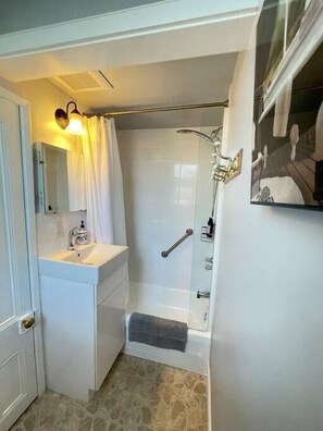 Bathtub, hair dryer, towels