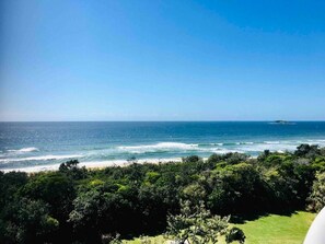 Escape to a serene coastal haven with breathtaking ocean views and lush greenery.