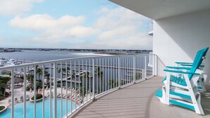A balcony with a view of a marina and a swimming pool. - Nautical Two Bedroom Condo Overlooking the Perdido Bay and Pools! Complimentary Boat Slip! (Orange Beach)