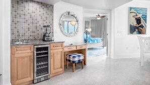 A modern kitchen with a built-in oven, a coffee maker, and a wine cooler. - Nautical Two Bedroom Condo Overlooking the Perdido Bay and Pools! Complimentary Boat Slip! (Orange Beach)