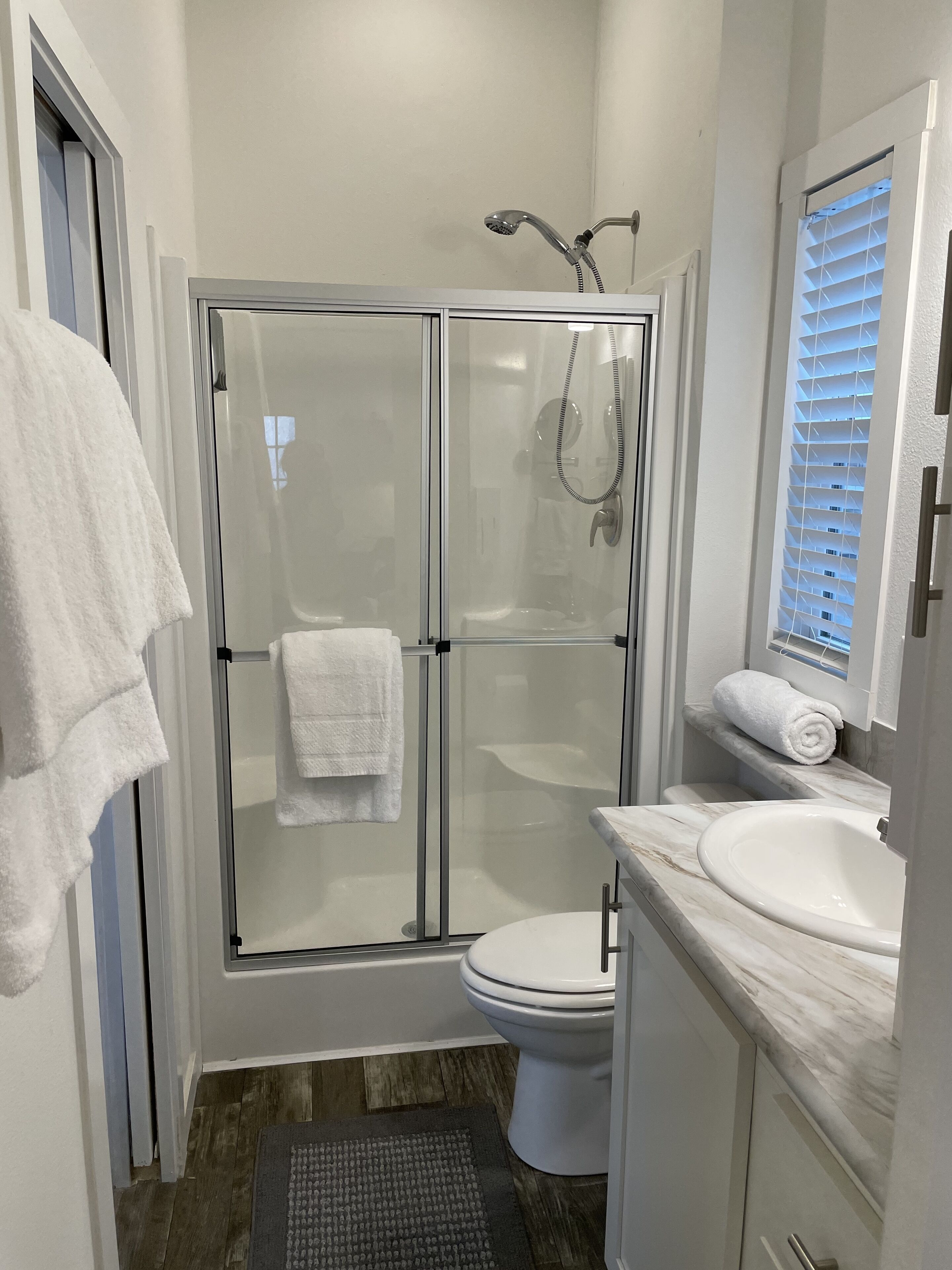 Shower, hair dryer, towels, soap