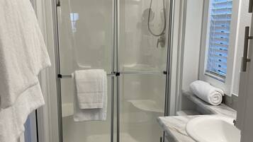 Shower, hair dryer, towels, soap