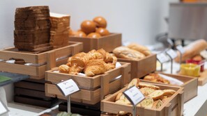 Baked goods on display in a charming bakery setting.