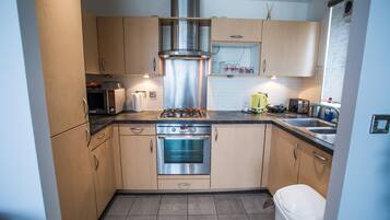 Full-sized fridge, freezer, paper towels, dining tables