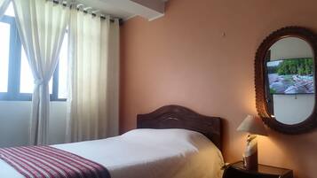 Individually decorated, laptop workspace, iron/ironing board, bed sheets