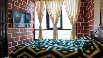 Individually decorated, laptop workspace, bed sheets