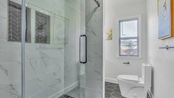 Combined shower/tub, hair dryer, towels, toilet paper