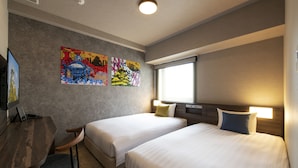 A hotel room with two beds, a desk, and a TV. - Just Sleep Osaka Shinsaibashi (Osaka)
