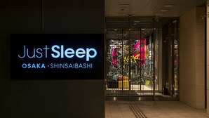 A hotel entrance with a sign reading "Just Sleep Osaka - Shinsaibashi". - Just Sleep Osaka Shinsaibashi (Osaka)