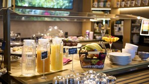 A breakfast buffet with various food items and beverages.