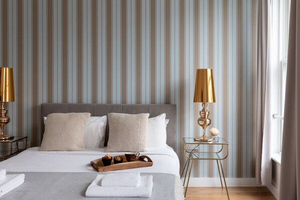 1 bedroom, desk, iron/ironing board, travel crib