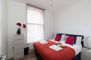 1 bedroom, desk, iron/ironing board, travel cot