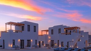 A modern building with multiple balconies and outdoor seating areas. - Le Palme Mykonos (Mykonos)
