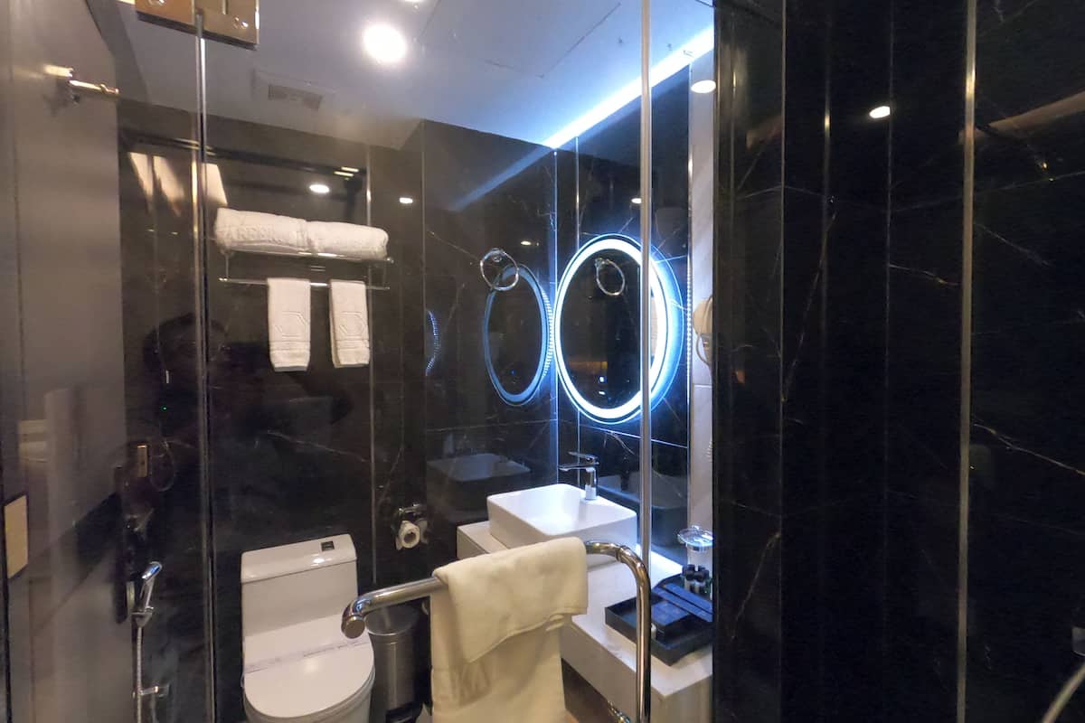 zabeer suite | bathroom | shower, slippers, towels