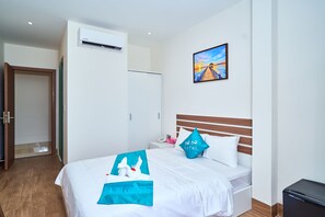 Habitación superior | Ropa de cama de alta calidad y colchones con acolchado adicional