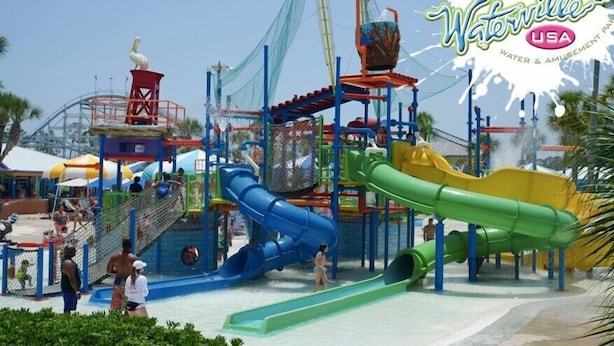 A water park with multiple slides and a lifeguard tower. - North Hampton: Luxury Gulf Shores Escape (Gulf Shores)