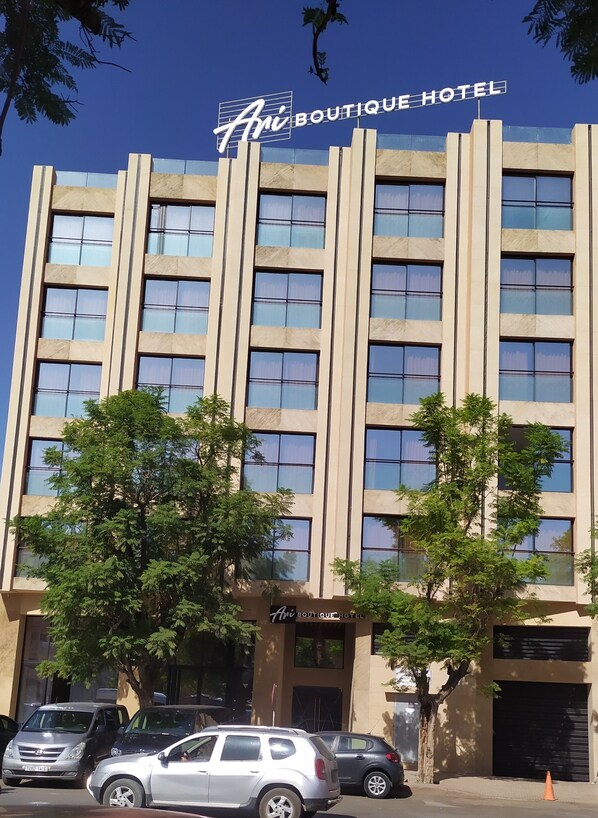 A multi-story hotel with a modern facade, large windows, and a sign reading "Ari Boutique Hotel." - Ari Boutique Hotel - Adults Only (Marrakech)