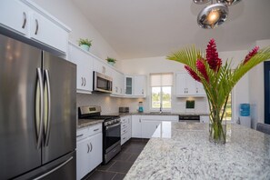 Fridge, cookware/dishes/utensils, dining tables