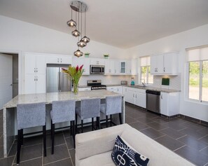 Fridge, cookware/dishes/utensils, dining tables