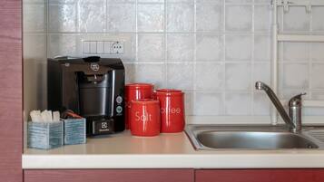 Fridge, stovetop, coffee/tea maker, cookware/dishes/utensils